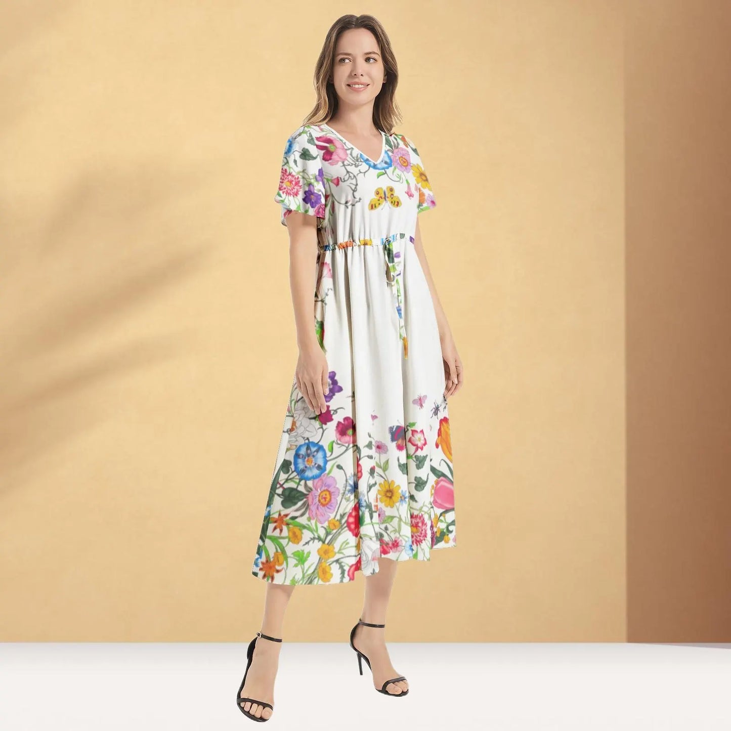 Stylish floral Gucci print maxi dress with a beautiful flowing design, ideal for both casual and formal events.

