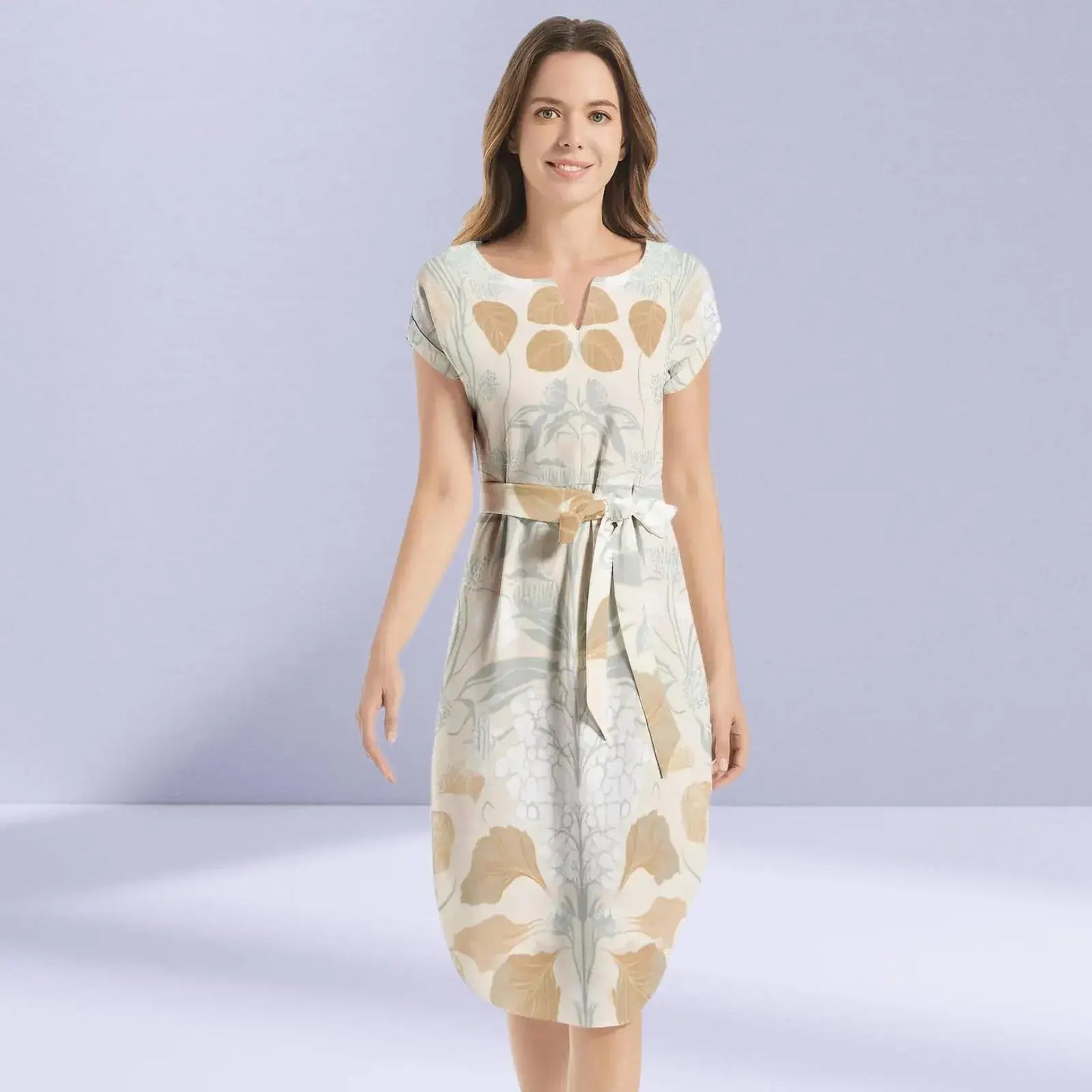 Elegant beige dress adorned with delicate floral patterns.