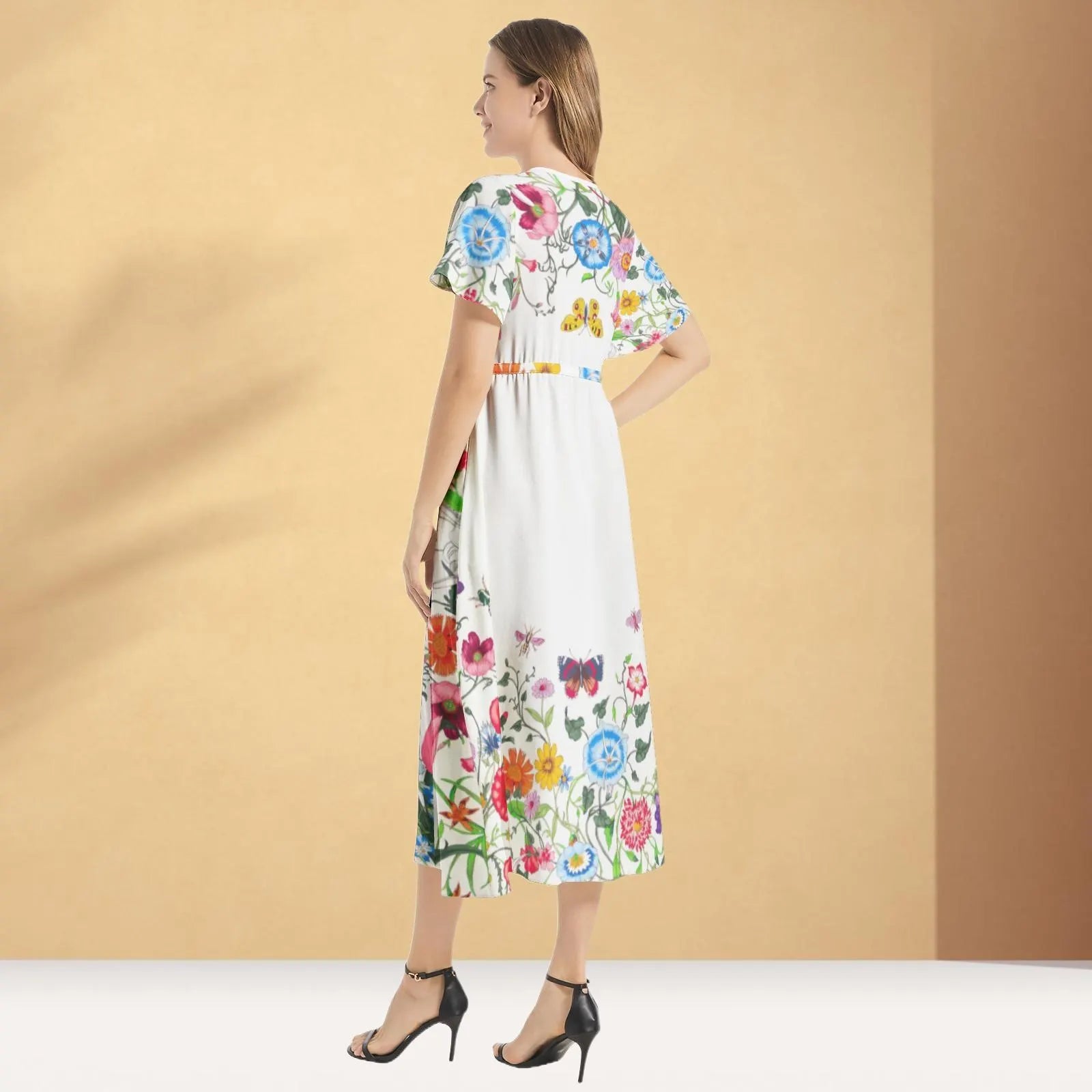 Elegant maxi dress with a luxurious floral Gucci pattern, offering a sophisticated look for any occasion.

