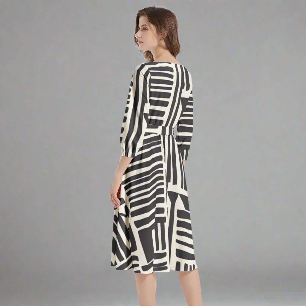 Model wearing the Black & White Geometrical Tribal Print Belted Dress styled for a modern look