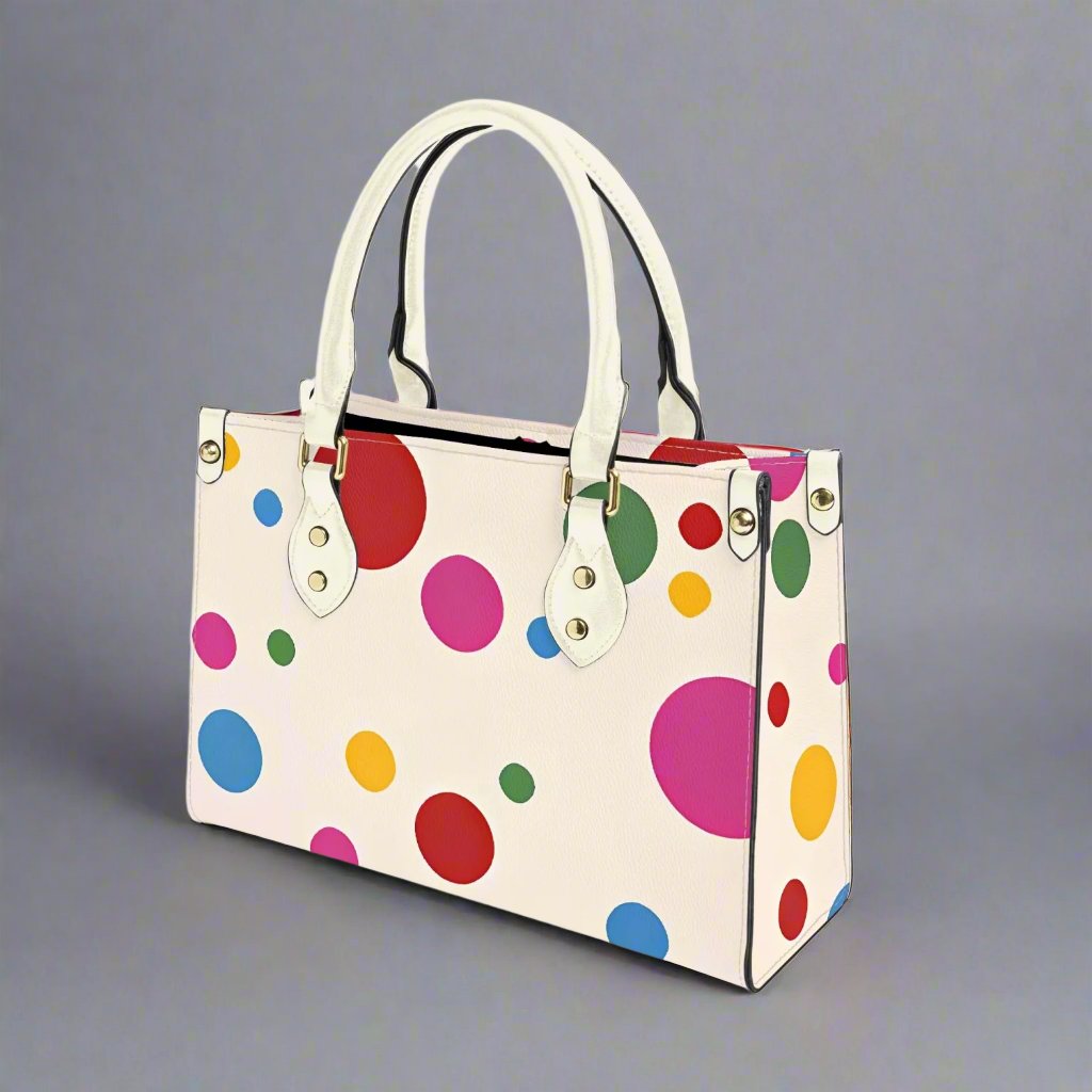 Colorful Yayoi Kusama Tote Bag with a rainbow polka dot design.