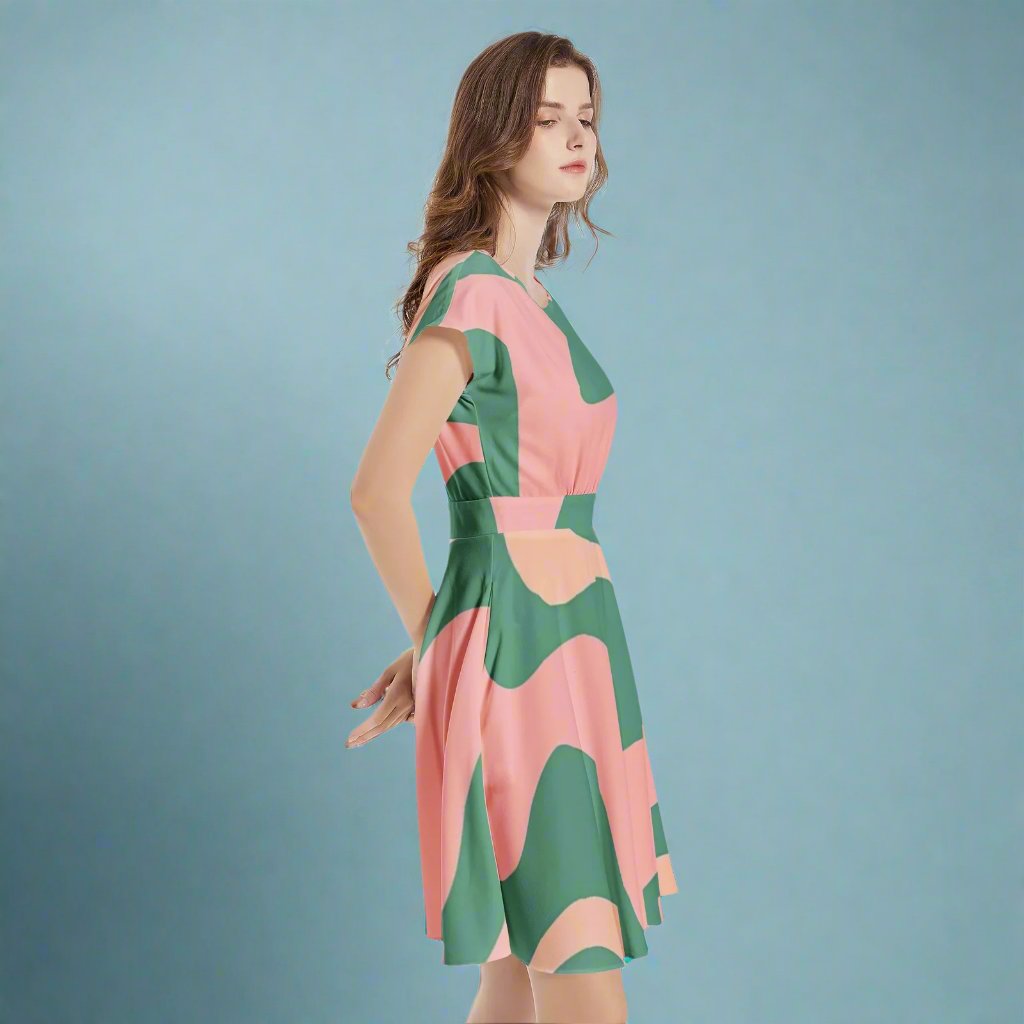 Close-up detail of the fabric and retro design of the Green & Pink 60s A-Line Midi Dress.