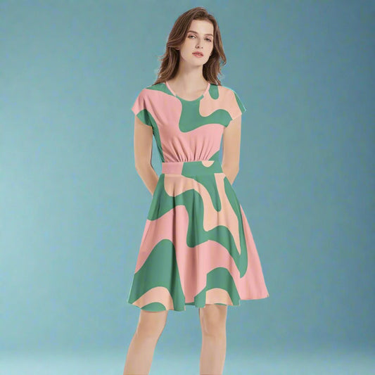 Front view of the Green & Pink 60s Retro A-Line Midi Dress showcasing its vibrant retro pattern