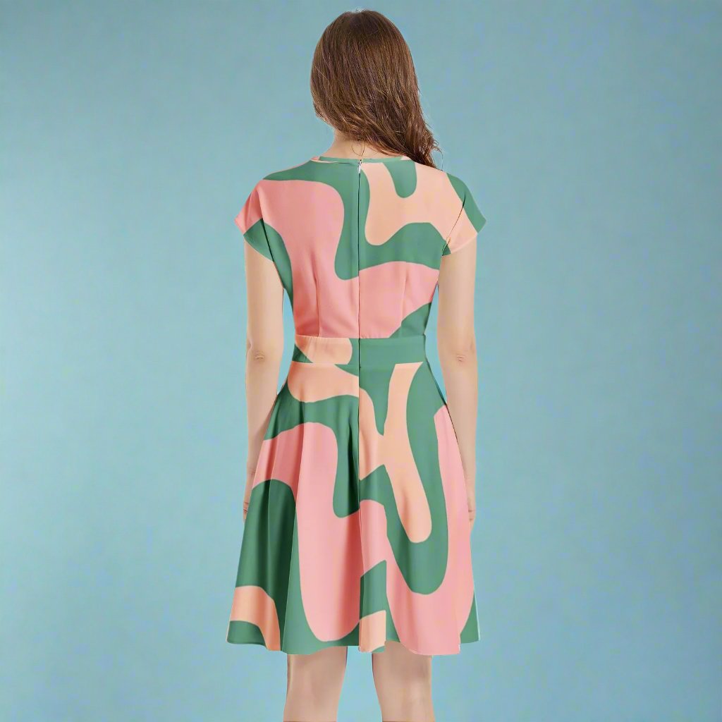 Model wearing the Green & Pink 60s Retro A-Line Midi Dress styled for a vintage-themed event.