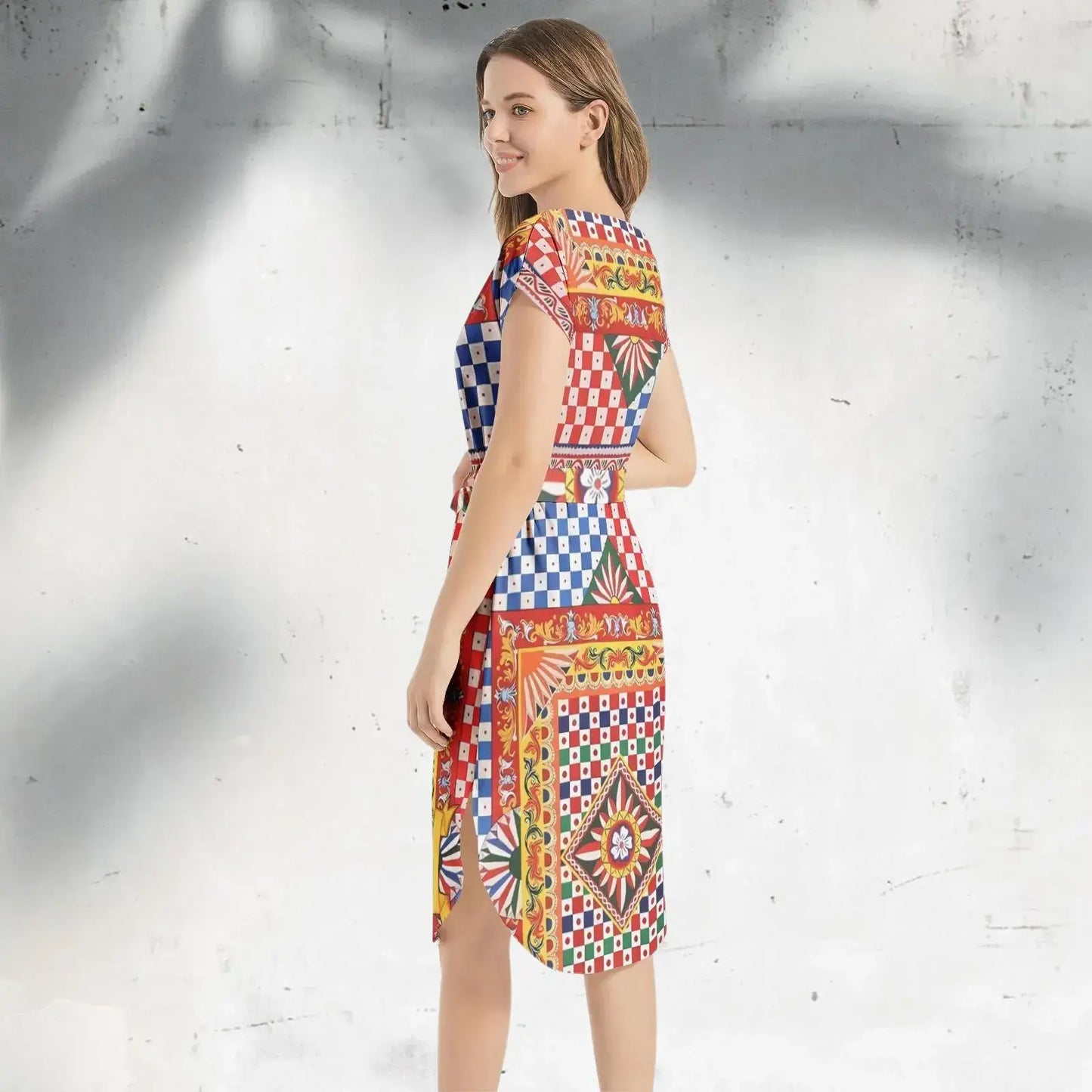 Back view of the Italian Sicily Dress with tie-back detail and intricate pattern design.