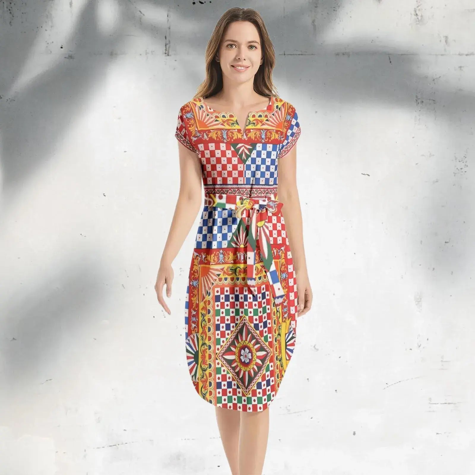 Front view of an Italian Sicily Dress with Mediterranean-inspired patterns in vibrant blue, yellow, and white hues.