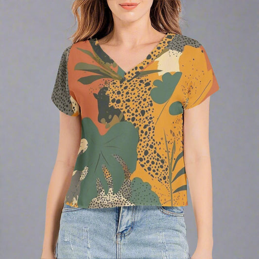 Front view of a Jungle Fever Sleeve V-Neck Top with vibrant green, yellow, and tropical patterns