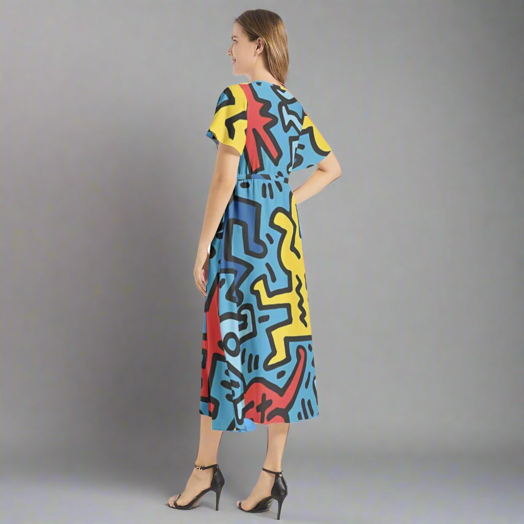 Close-up of the fabric of the Keith Haring Blue Maxi Dress, showing the intricate patterns and textures.