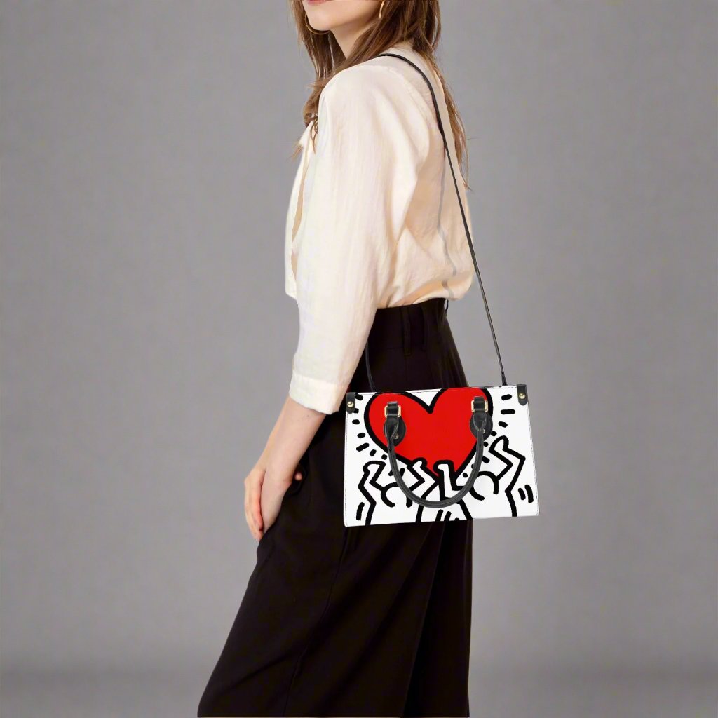 Back view of the Keith Haring 'Love' Small Tote Bag with minimal design on vegan leather.