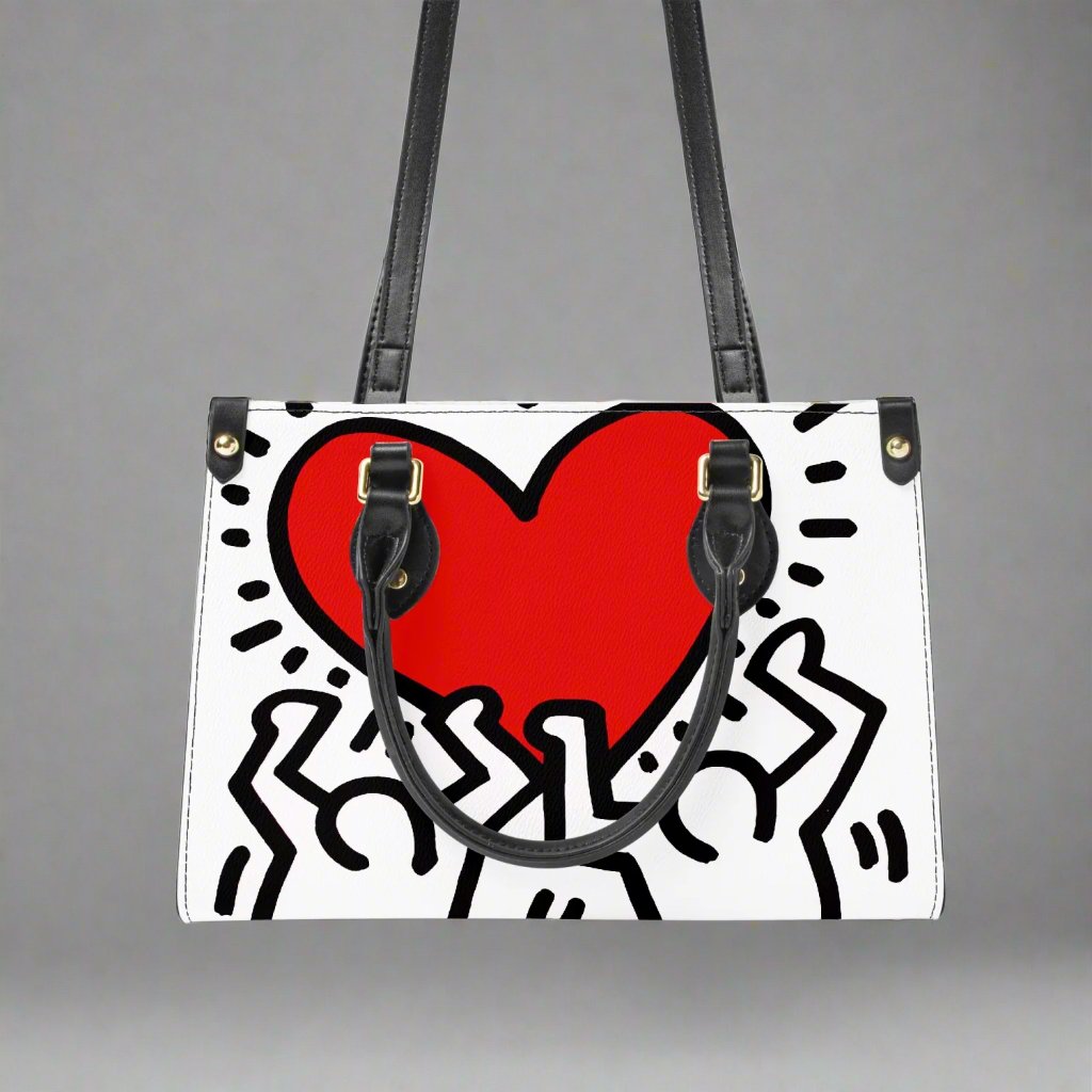 Close-up of the Keith Haring 'Love' design on vegan leather, showing the textured finish and bold colors.