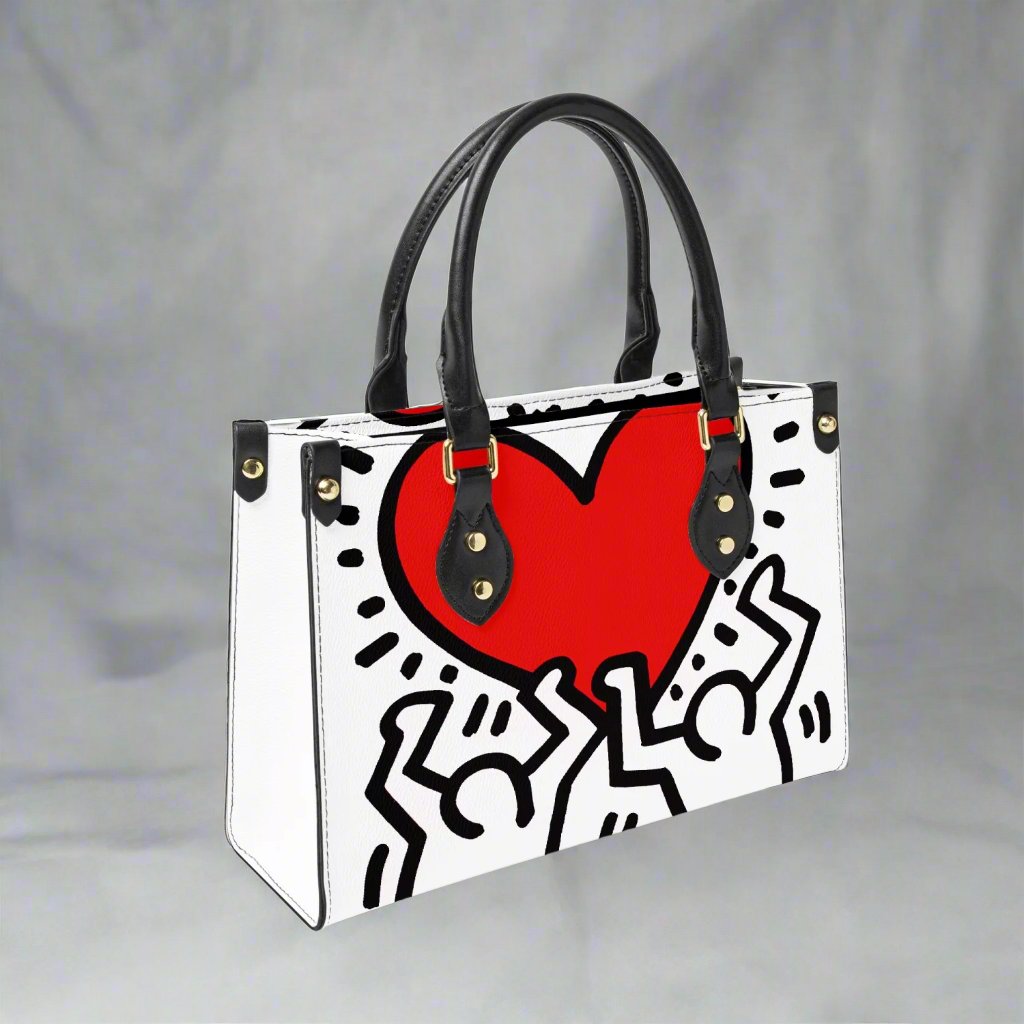 Side profile of the Keith Haring 'Love' Tote Bag, highlighting the compact size and durable vegan leather material.