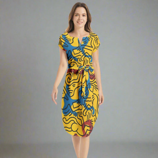 Front view of the Keith Haring Yellow Belted Dress showcasing vibrant yellow fabric and bold patterns.