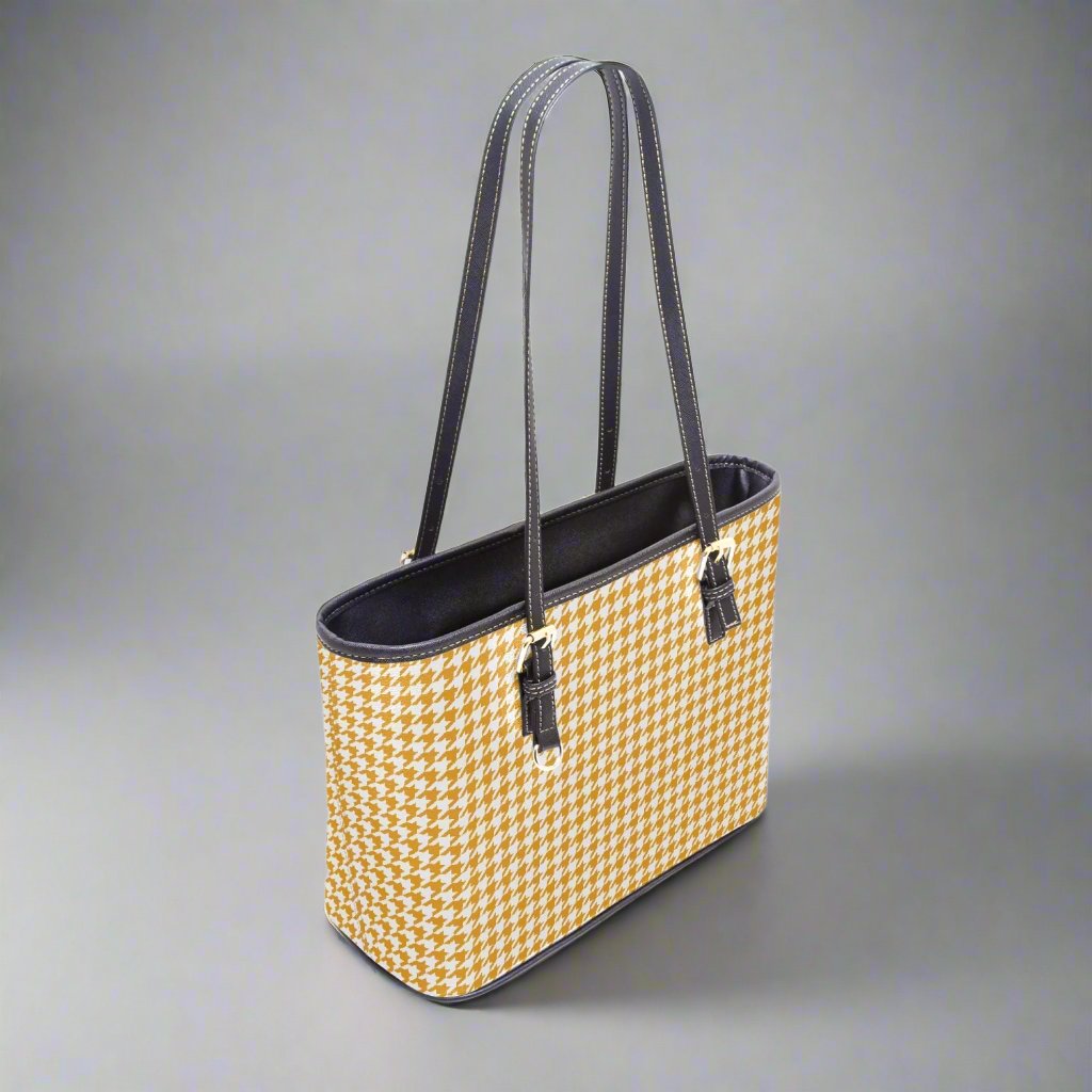 Side profile of the Large Yellow Houndstooth Tote Bag, emphasizing its spacious interior and sturdy handles.