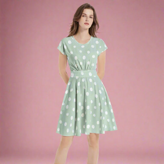 Add a playful touch to your wardrobe with our Mint Dot A-Line Midi Dress. Perfect for summer outings, this dress combines style and comfort