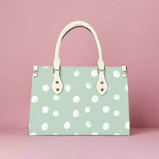 Upgrade your accessory game with our Mint Dot Vegan Leather Tote Bag! Stylish and eco-friendly, perfect for everyday use and on-the-go essentials.