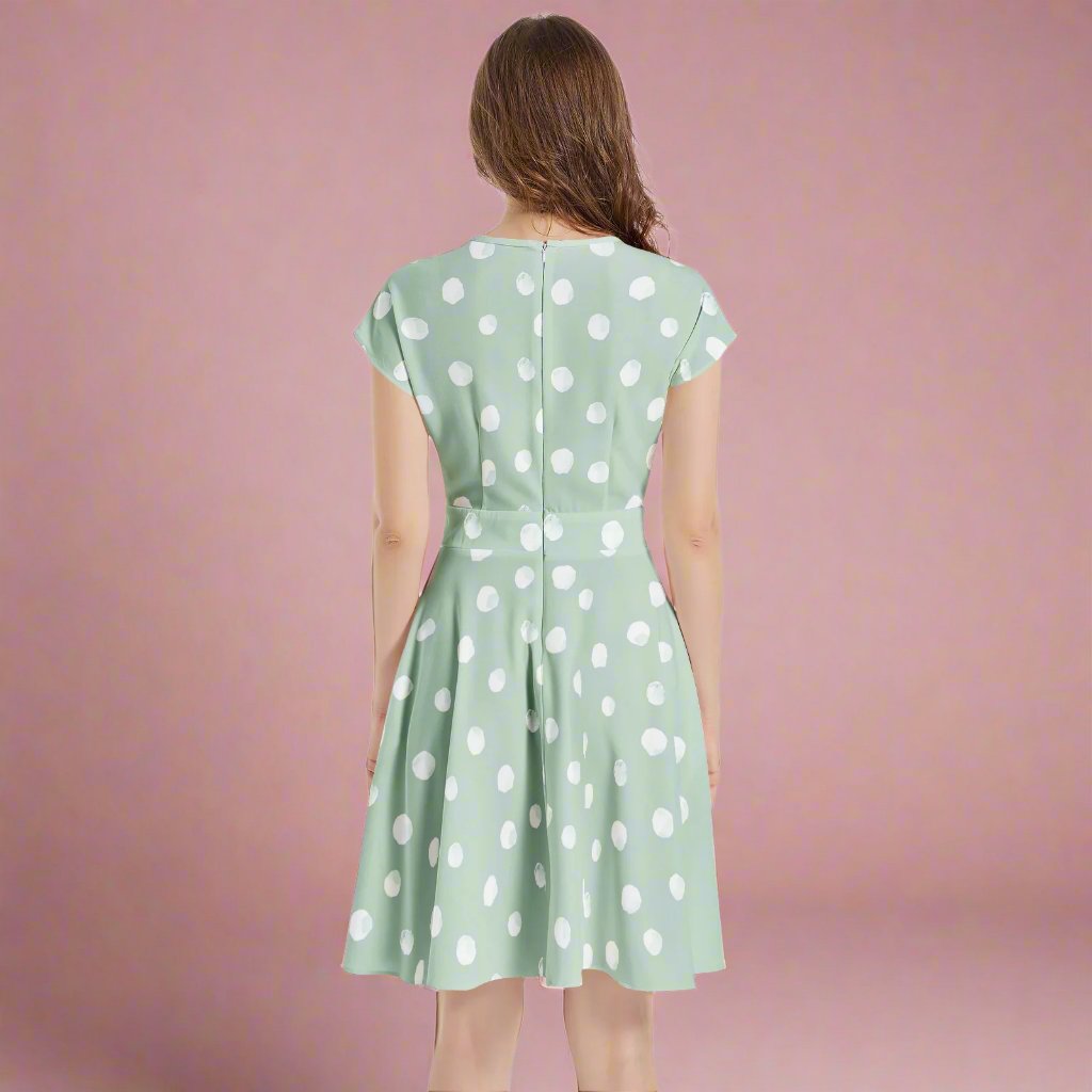 Embrace a timeless look with our Mint Dot A-Line Midi Dress, designed for comfort and style—perfect for warm weather events and gatherings.