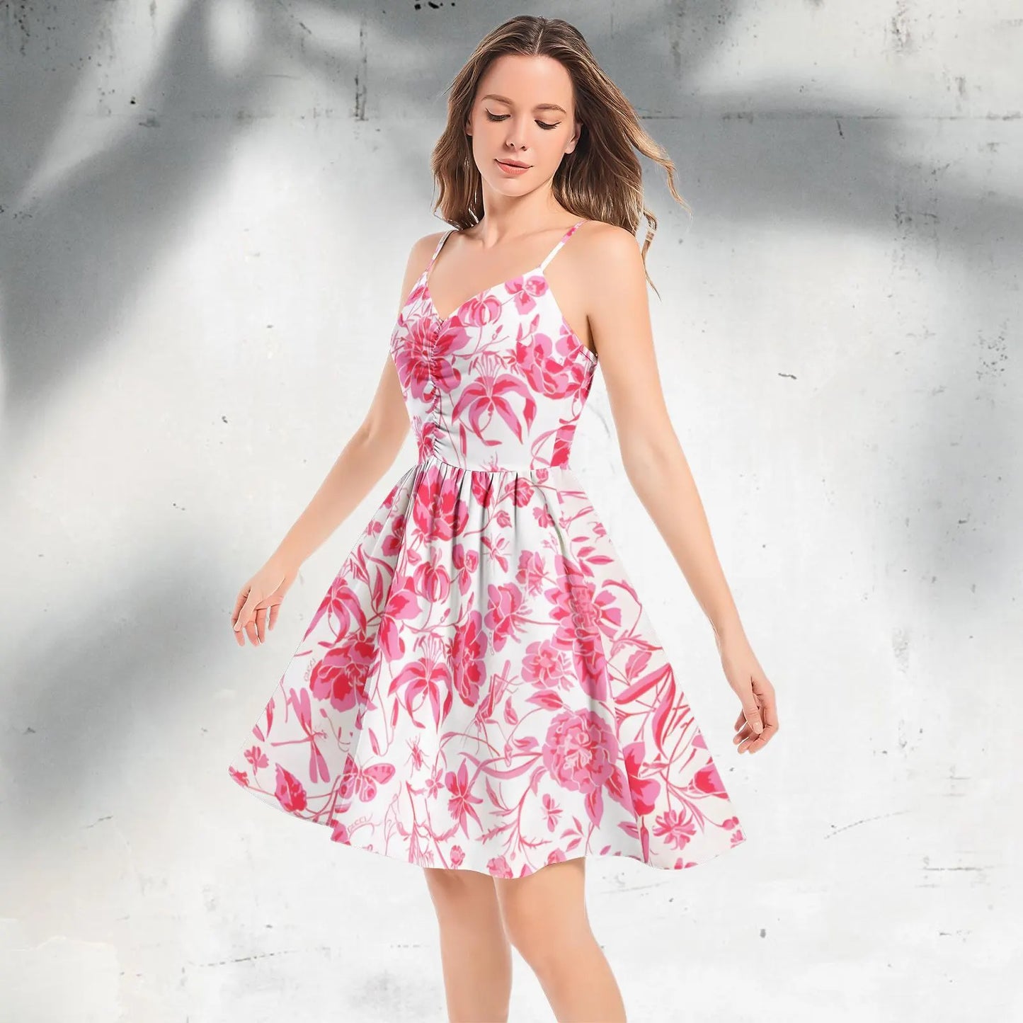 Lifestyle shot of the Red Floral Dress worn at a picnic in the park.