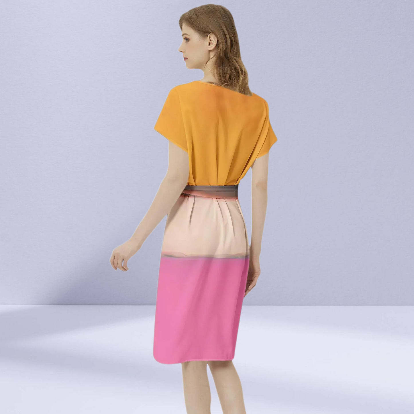 Side profile of the Rothko Orange Pink Dress, emphasizing its flattering silhouette.