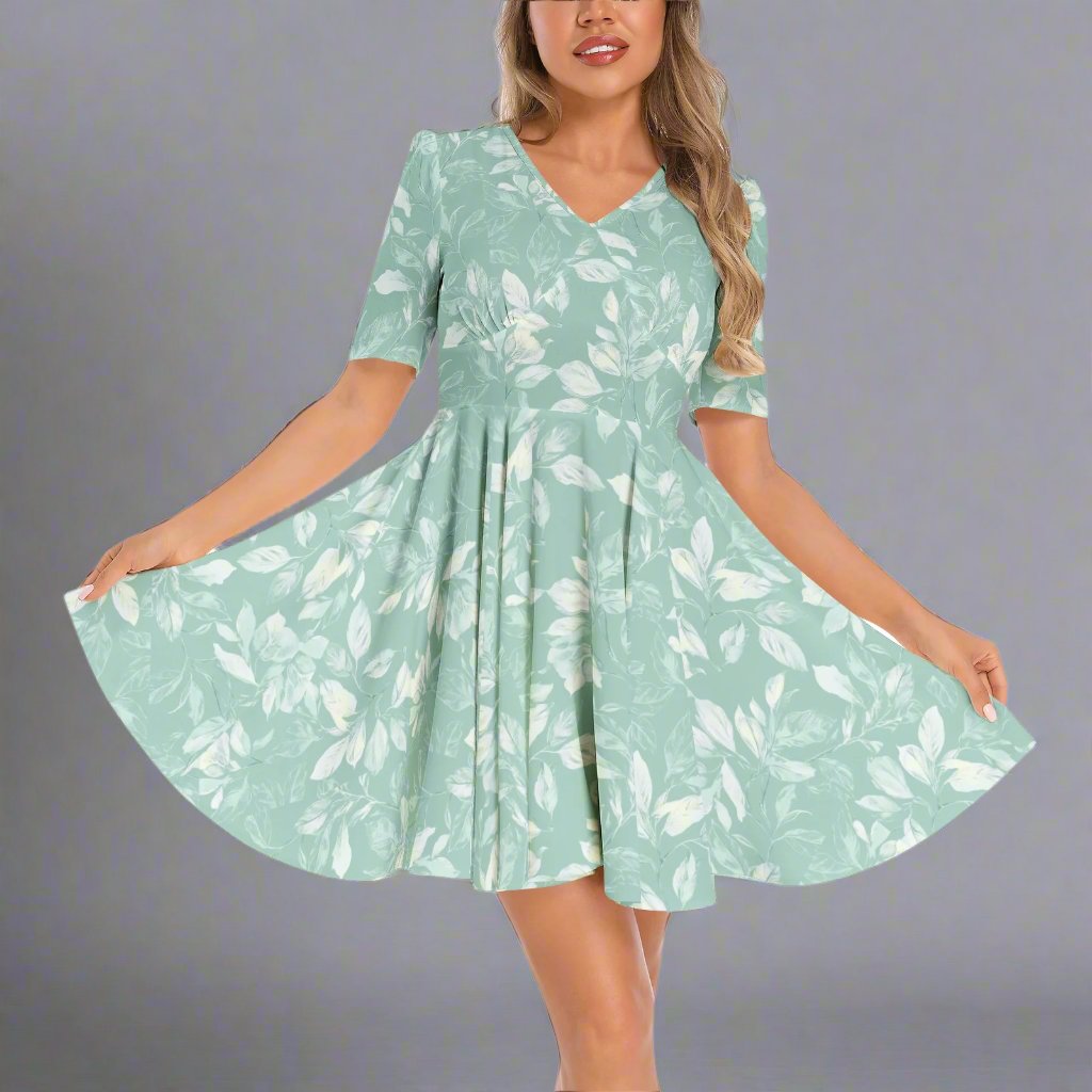 Front view of the Sage Green Floral Flared Hem Dress showcasing its delicate floral design