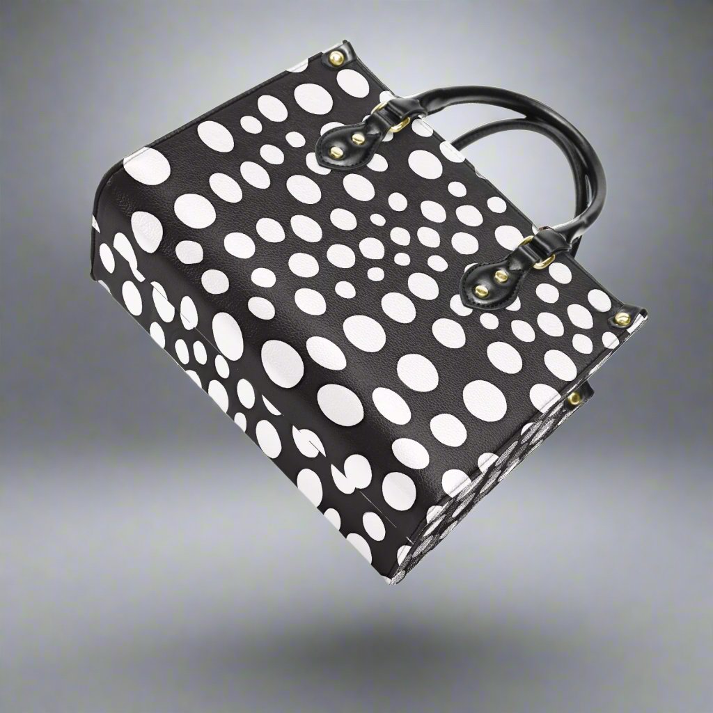 Back view of the Yayoi Kusama White Dot Tote Bag featuring a smooth finish.