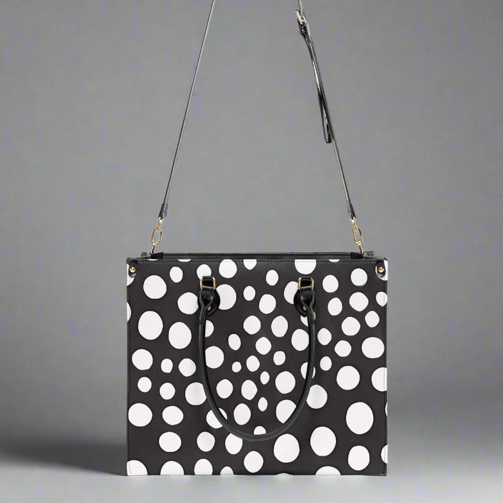 Side profile of the Yayoi Kusama White Dot Tote Bag, emphasizing its spacious design.