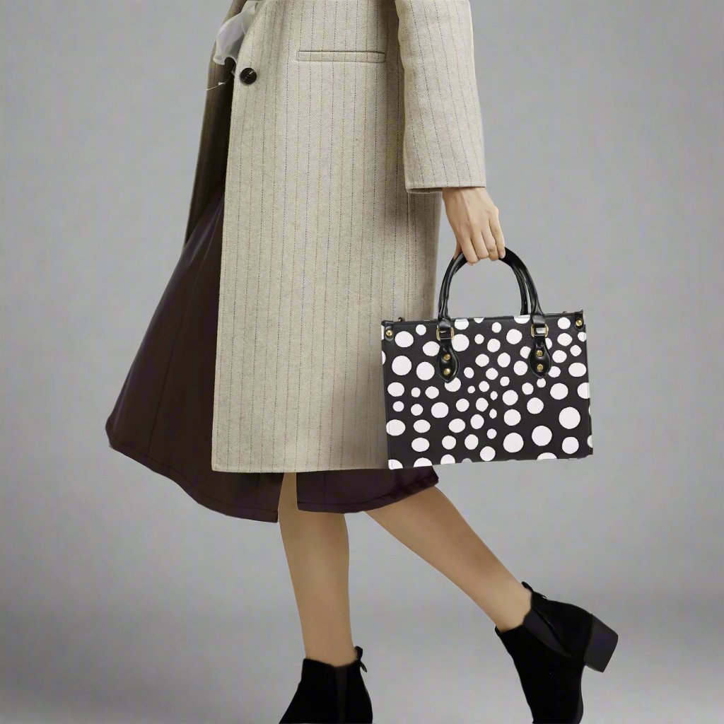 Yayoi Kusama White Dot Tote Bag styled with accessories for a trendy look.