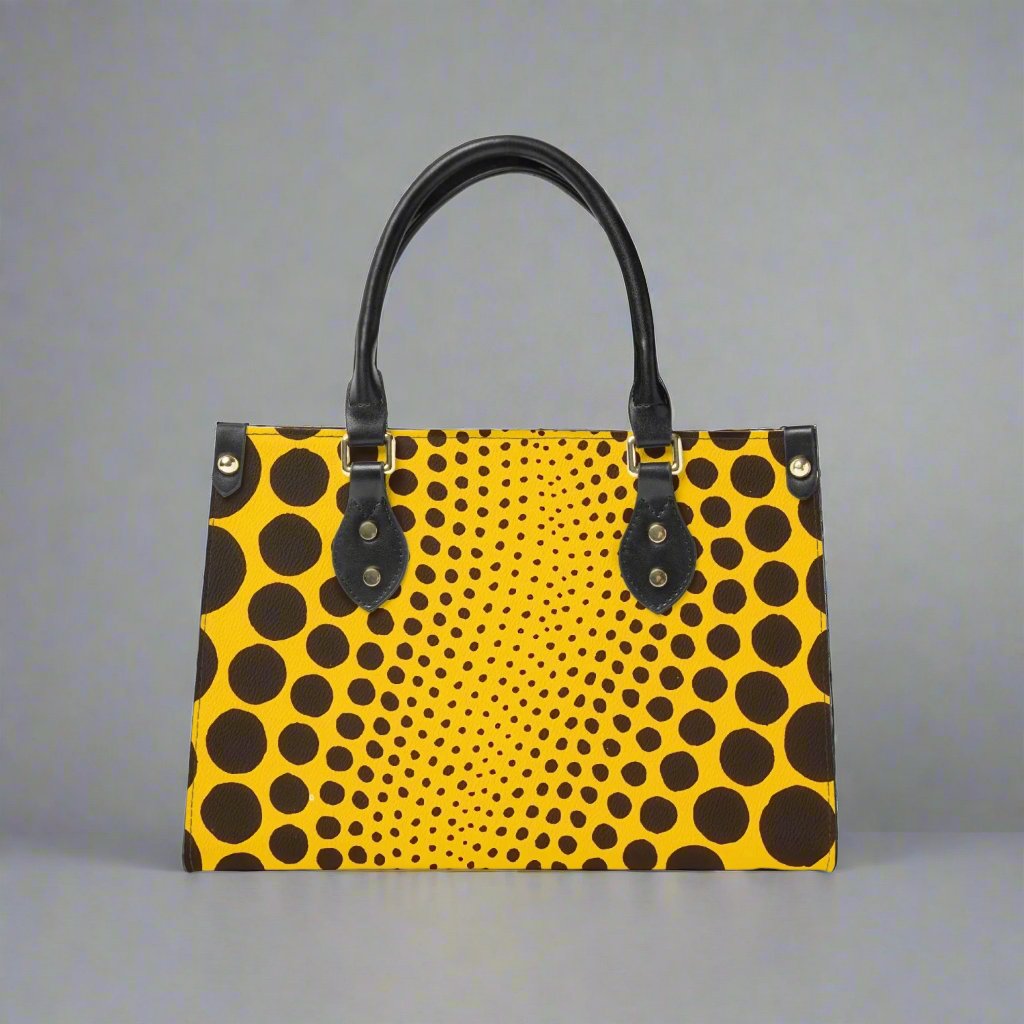 Front view of the Yayoi Kusama Yellow Dot Tote Bag showcasing its vibrant design